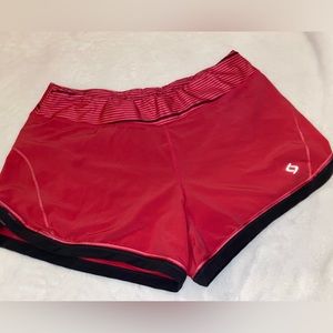 Moving Comfort lined athletic shorts.